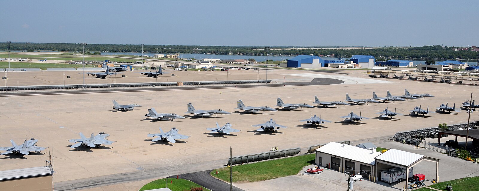 The NAS JRB Fort Worth flightline from above, with Lake Worth in the background